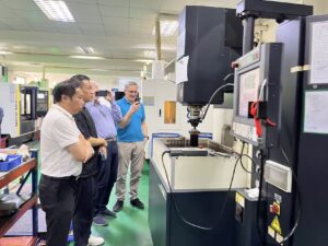 European client reviewing injection molded parts with YIOT quality team
