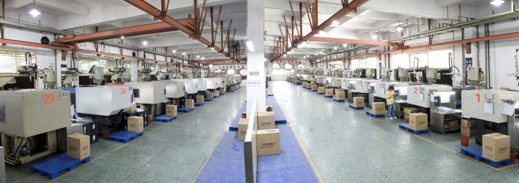 Rows of automated injection molding machines in a workshop