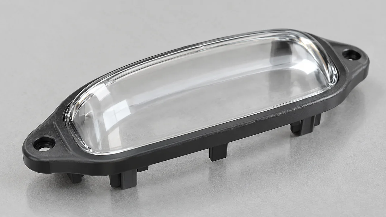 Opaque molded frame with an integrated transparent lens region