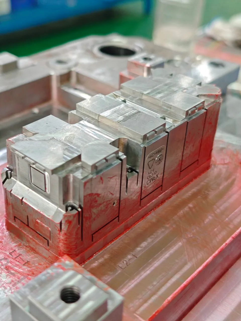 Assembled injection mold with machined plates and mold components