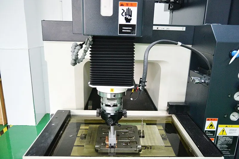 EDM machining a mold component in the toolmaking workshop